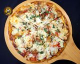 A picture of step 10 of Cheese Burst Veggies And Chicken Pizza From Scratch.