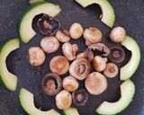 A picture of step 3 of My Buttered Salt n pepper Mushroomson,Advocado on bed of Spinach.