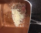 A picture of step 2 of Shaved beef stuff pepper with white Queso cheese.