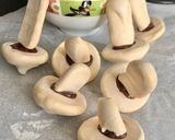 A picture of step 21 of Yule Log with Meringue Mushrooms.