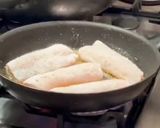 A picture of step 2 of Pan fried sea bream with sake braised clams and broccolini.