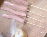 A picture of step 2 of Stick egg net sausage.