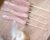 A picture of step 2 of Stick egg net sausage.