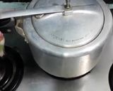 A picture of step 13 of EGGLESS CHOCOLATE CAKE (IN PRESSURE COOKER).