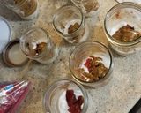A picture of step 1 of Blueberry, Pomegranate, Peanut Butter & Plum Jam Overnight Oats.