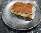 A picture of step 6 of Tiramisu with whipping cream.