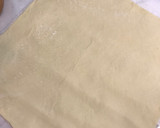 Foto del paso 4 de la receta: Rollo salado de masa hojaldrada