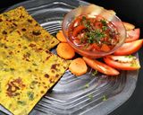 A picture of step 4 of Methi ka paratha with tomato chutney.