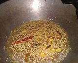 A picture of step 1 of Cauliflower curry with white gravy.