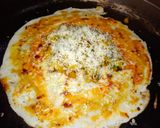 A picture of step 4 of Shezwan masala cheese Dosa roll.