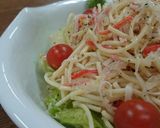 A picture of step 4 of Crab Stick & Onion Italian Pasta Salad.
