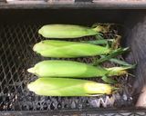 A picture of step 2 of California Farm Grilled Sweet Corn in the Husk.