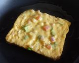 A picture of step 4 of Bread Besan Masala Toast.