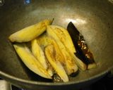 A picture of step 2 of Niramish Doi Begun (Brinjal masala curry).