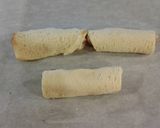 A picture of step 4 of Ham and Cheese Toasted Roll Ups.