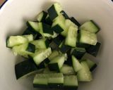 A picture of step 1 of Cucumber and feta za’atar salad.