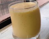 A picture of step 2 of Pineapple and mango smoothie, with ice cream.