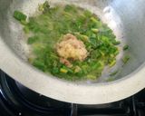 A picture of step 3 of Turmeric rice and beans.