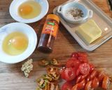 A picture of step 1 of Baked eggs with tomatoes and avocado.