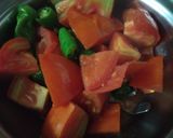 A picture of step 1 of Tomato tambli (tomato raita).