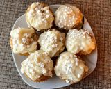 A picture of step 10 of Mascarpone filled carrot cake muffins/cupcakes.