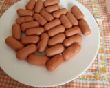 Foto del paso 12 de la receta: Patatas rústicas congeladas en Freidora de Aire con calabacín y mini salchichas al Microondas