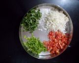 A picture of step 2 of Rava Uttapam with veggies, packed with fruits and dryfruits.