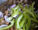 A picture of step 7 of Dry Beef chilli with garlic rice.