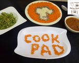A picture of step 8 of White and orange rice (cookpad logo).