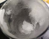 A picture of step 4 of Rising Sun Cocktail.