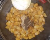 A picture of step 2 of Steamed Masala cheesy and salty sweet corn recipes.