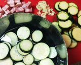A picture of step 1 of Eggplant and Zucchini Bacon Tomato Pasta.