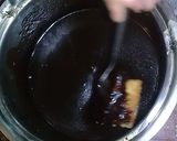 A picture of step 13 of Australian cake.. chocalate toping on vanilla cake.