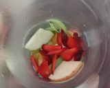 A picture of step 1 of Fruit sangria.
