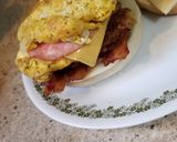 A picture of step 3 of Four Meat, Four Cheese Bagel Breakfast Sandwich.