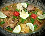 A picture of step 5 of Meat paella and chicken, fish.