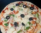 A picture of step 8 of Chicken tikka pizza.