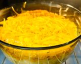A picture of step 4 of Hake in the oven under a cheese crust.