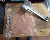 A picture of step 1 of Chicken Breast Stuffed with Ham and Cheese. Peas and Potatoes.