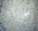 A picture of step 1 of Egg and parsley fried rice.