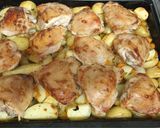 A picture of step 6 of Chicken thighs in "onion" mayonnaise with vegetables, in the oven.