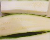 A picture of step 1 of Feta and tomato stuffed courgettes.