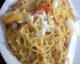 A picture of step 3 of Indomie with cook egg.