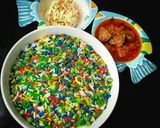 A picture of step 5 of Dammies coloured rice served with meat balls in sauce & coleslaw.