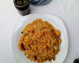 A picture of step 4 of Jollof rice with smoked fish.