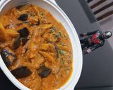 A picture of step 7 of Brinjal potato curry.