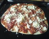 A picture of step 5 of Smokie pizza.