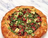 A picture of step 18 of Puttanesca galette with lemon ricotta.