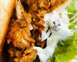 A picture of step 4 of Zinger burger with fries.