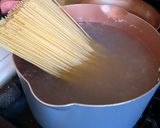 A picture of step 1 of Garlic Noodles with Shrimp.